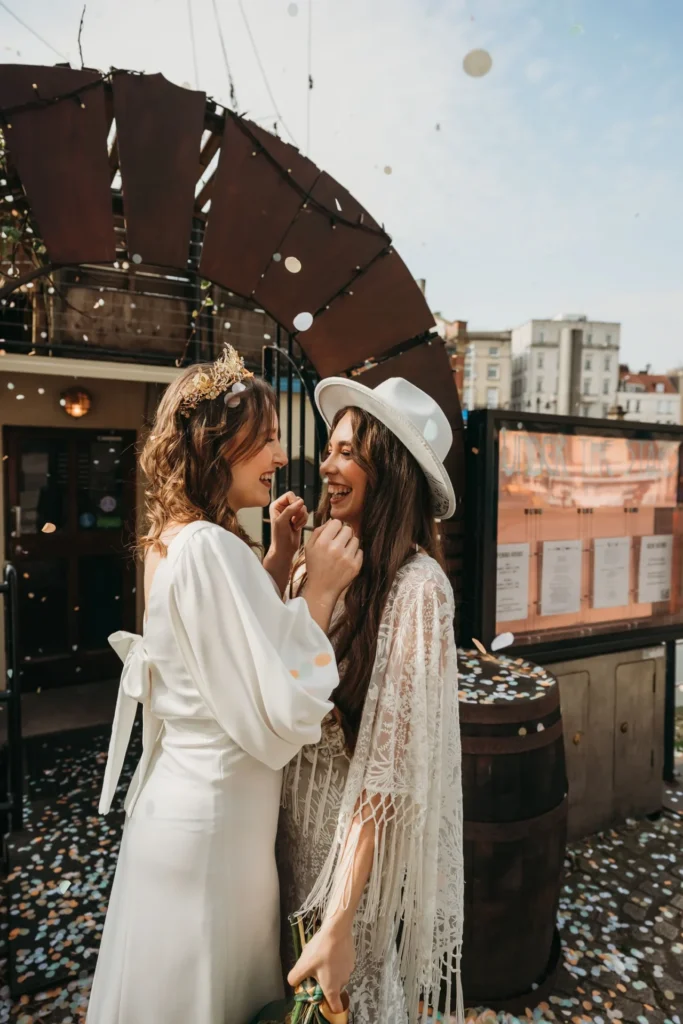 Photograph of two brides who have had their wedding hair styled by Amy Marie Bridal Hair